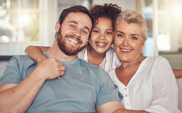 Photo portrait happy family and grandmother kid and father in home bonding and relax together in living room face smile and dad girl and grandma with care love and interracial for adoption in house