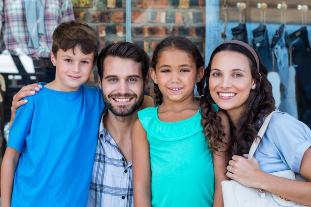 Portrait of a happy family having fun in the mall