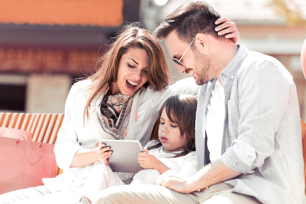 Portrait of happy family having fun togethertaking selfie