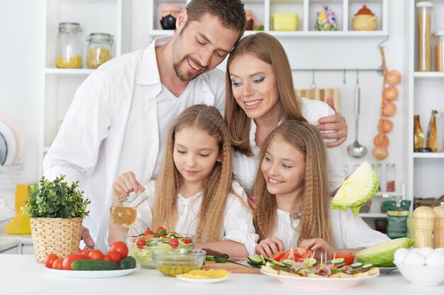 Portrait of a happy family at kitchen