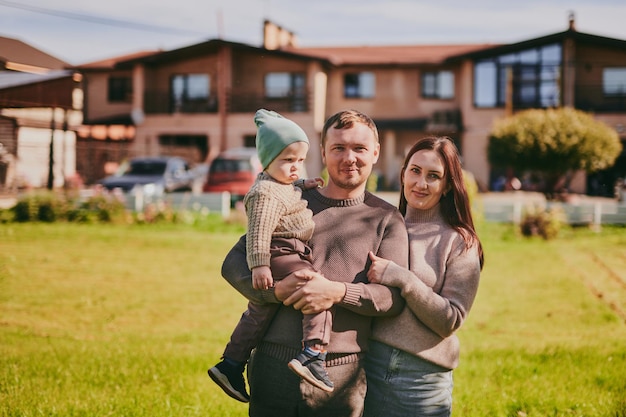 Photo portrait happy family mom dad and son having fun and enjoying spending time together in autumn park on sunny day love and loyalty young parents