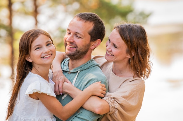 Portrait of a happy family in nature