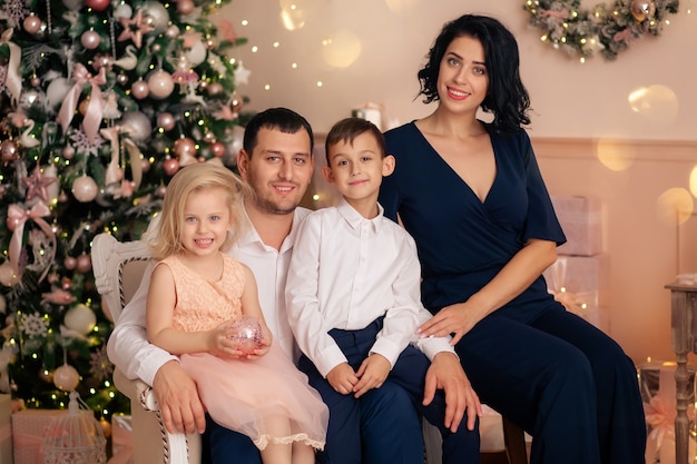 Portrait of a happy family in a new year interior