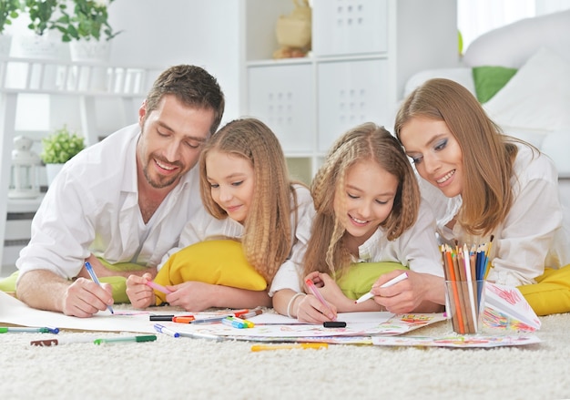 Portrait of a happy family painting together