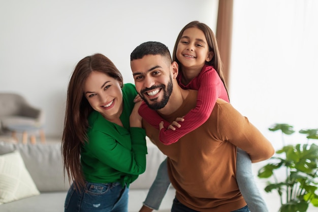 Portrait of happy family playing, having fun at home