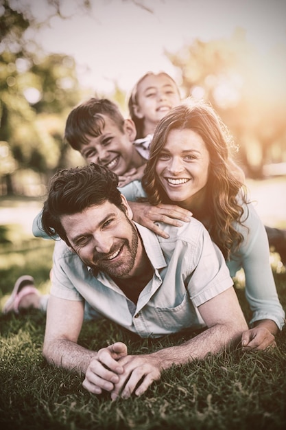 Portrait of happy family playing in park