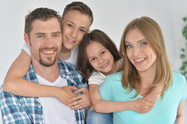 Portrait of happy family posing at home