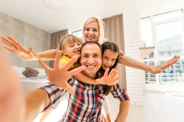 Portrait of a happy family smiling at home