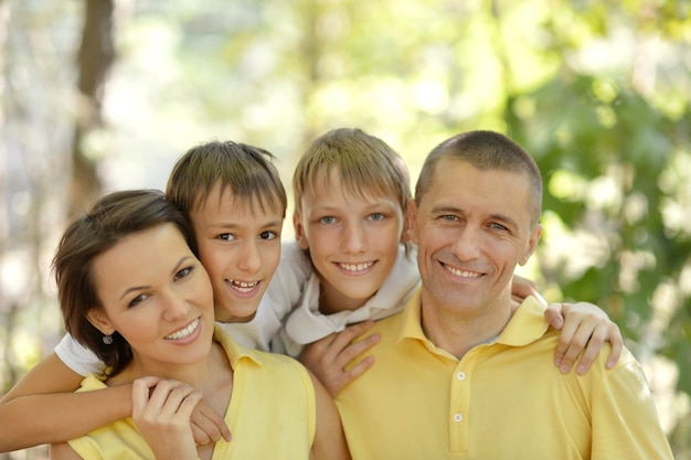 Portrait of a happy family in summer park