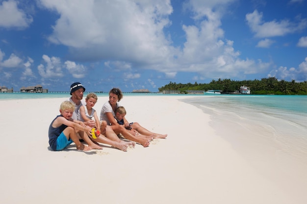 Portrait of a happy family on summer vacation  at beach