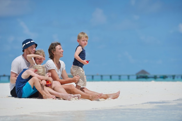 Portrait of a happy family on summer vacation  at beach