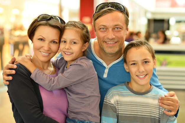 Portrait of a happy family  walking in city