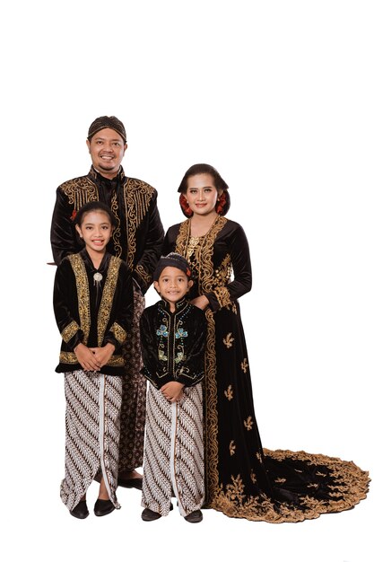 Portrait of a happy family wearing traditional Javanese clothes