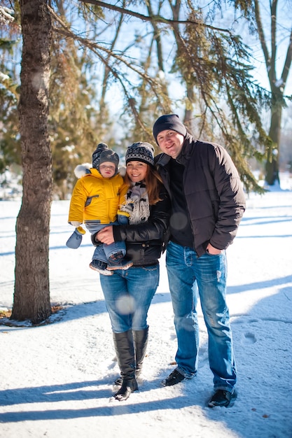 Portrait of happy family in winter park