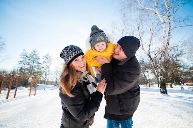 Portrait of happy family in winter park