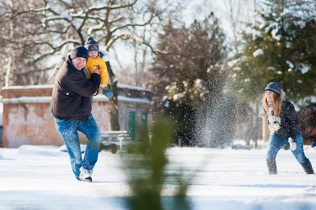 Portrait of happy family in winter park