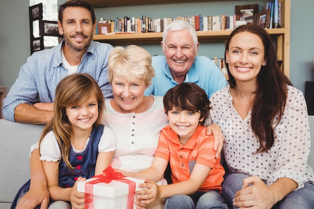 Portrait of happy family with gift box