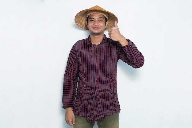 portrait of happy farmer showing thumb up isolated on white background