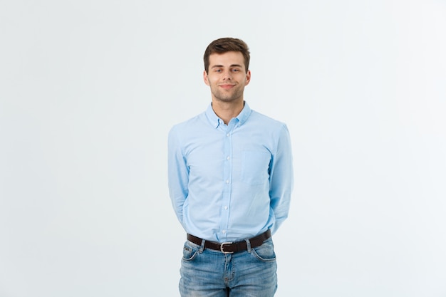 Portrait of happy fashionable handsome man in jeans and blue shirt look at camera