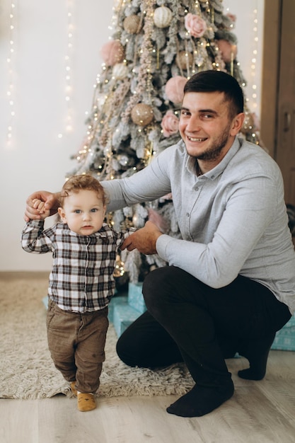 Portrait of happy father with son celebrating Christmas New Year's holidays