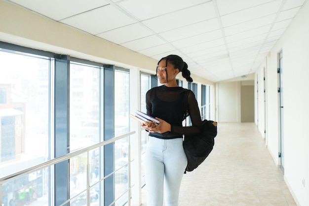 Portrait of happy female african american college student