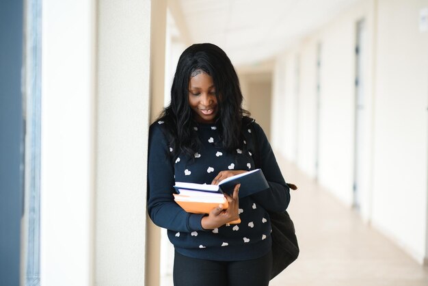 Portrait of happy female african american college student