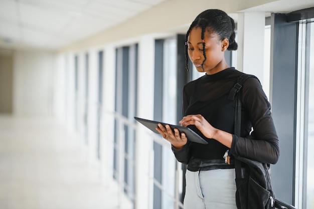 Portrait of happy female african american college student