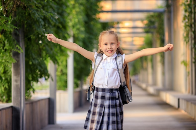 Portrait of a happy first grader schoolgirl