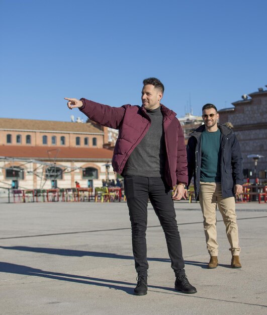 A portrait of happy gay couple outdoors