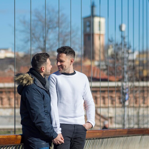 A portrait of happy gay couple outdoors