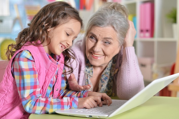 Portrait of happy grandmother and daughter