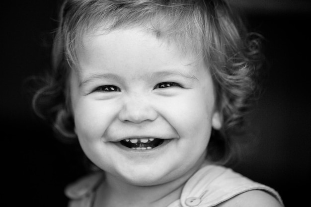 Portrait of a happy laughing baby close up positive kids face smiling infant cute smile