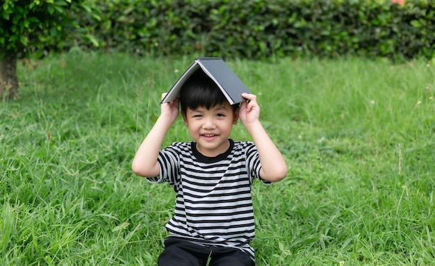 Portrait of a happy little boy in the park