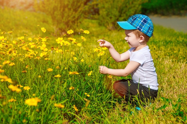 Portrait of a happy little boy in the park