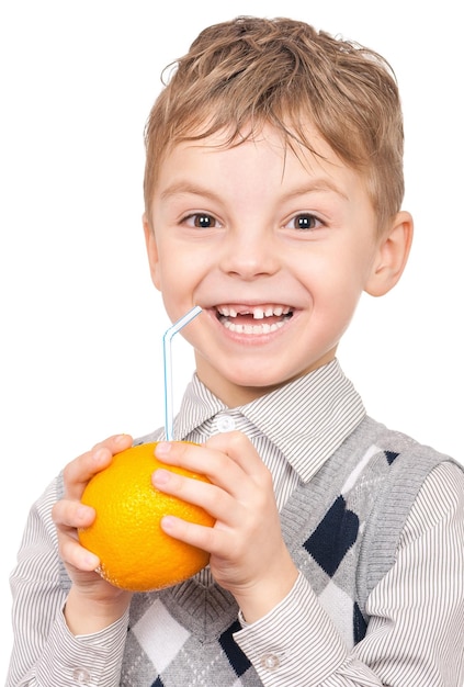 Portrait of happy little boy with orange juice isolated on white background