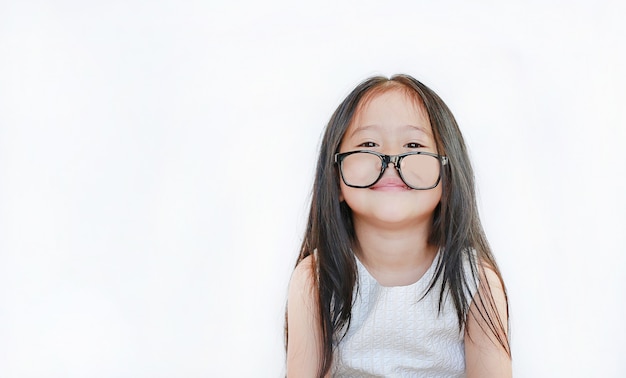 Portrait of happy little girl with glasses on white background.