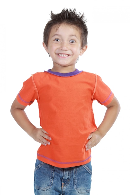 Portrait of a happy little young boy standing with over white background