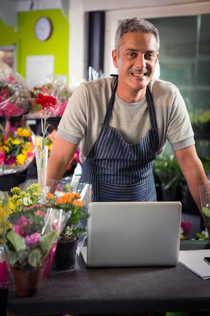 Portrait of happy male florist