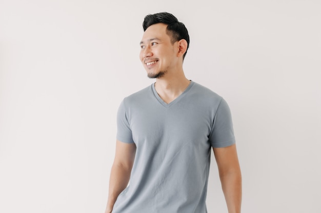 Portrait of happy man in blue tshirt isolated on white background