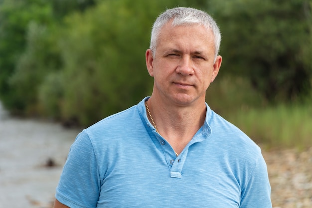 Portrait of a happy man in forest