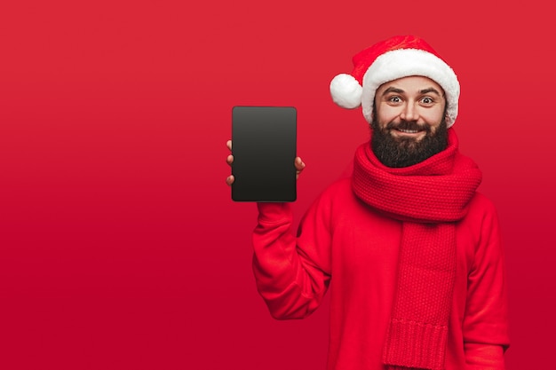 Portrait of a happy man in Santa hat