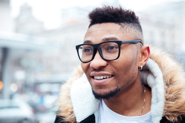 Portrait of happy man walking on the street.