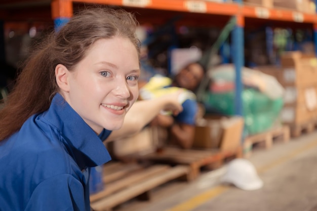 Portrait of happy mature African American man working in warehouse This is a freight transportation and distribution warehouse Industrial and industrial workers concept