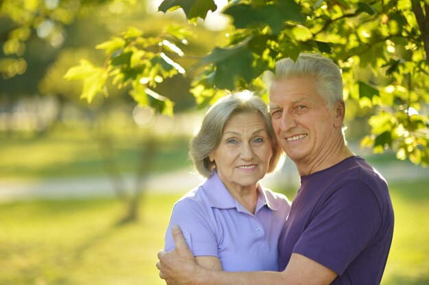 Portrait of a happy Mature couple in autumn park