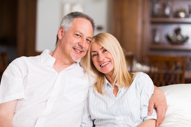 Portrait of an happy mature couple in their home