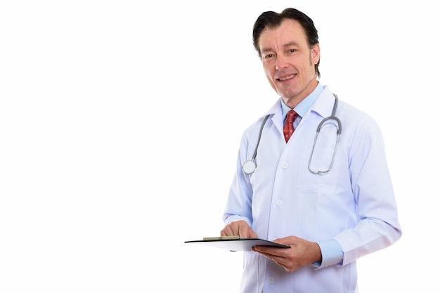 Portrait of happy mature handsome man doctor holding clipboard