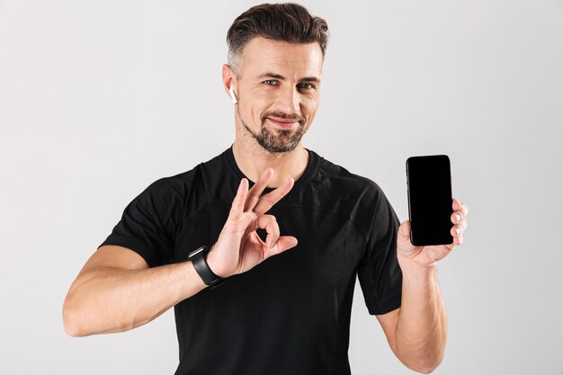 Portrait of a happy mature sportsman