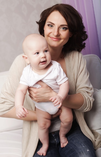 Portrait of happy mother and baby