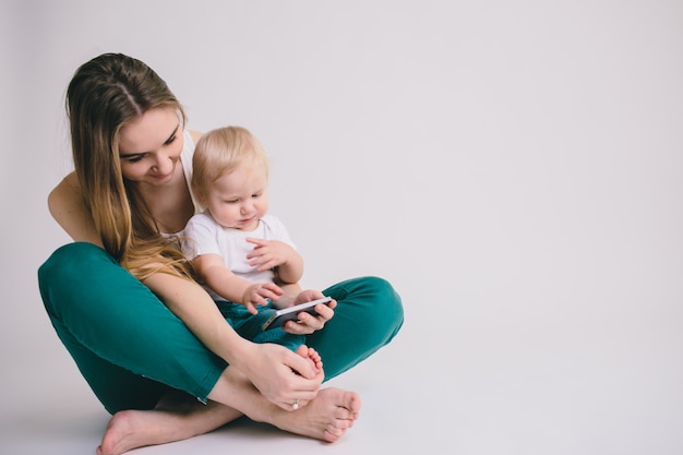 Portrait of happy mother with her little baby