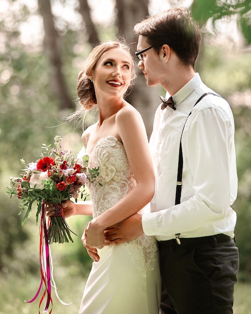 Portrait of happy newlyweds on the wedding day